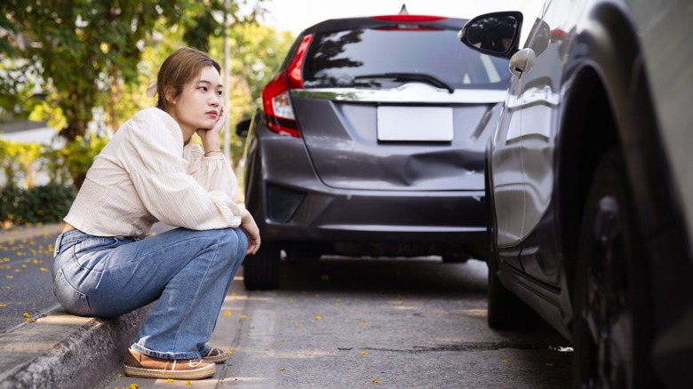 Young woman waiting after a car accident.
