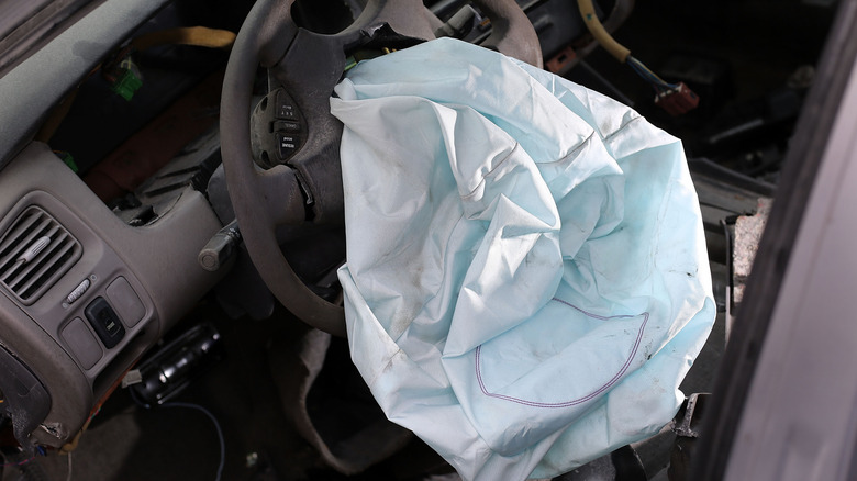 A deployed airbag seen in a Honda.