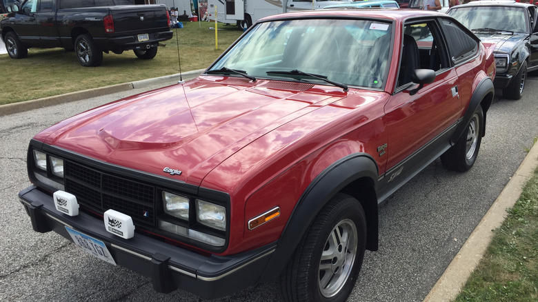 A red AMC Eagle with a low speed bumper