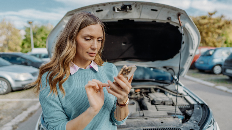 Woman calling for assistance with car that won't start