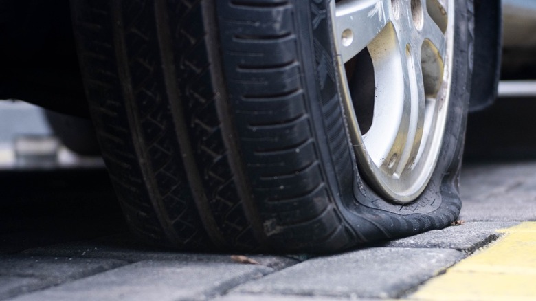 Closeup of a flat tire.
