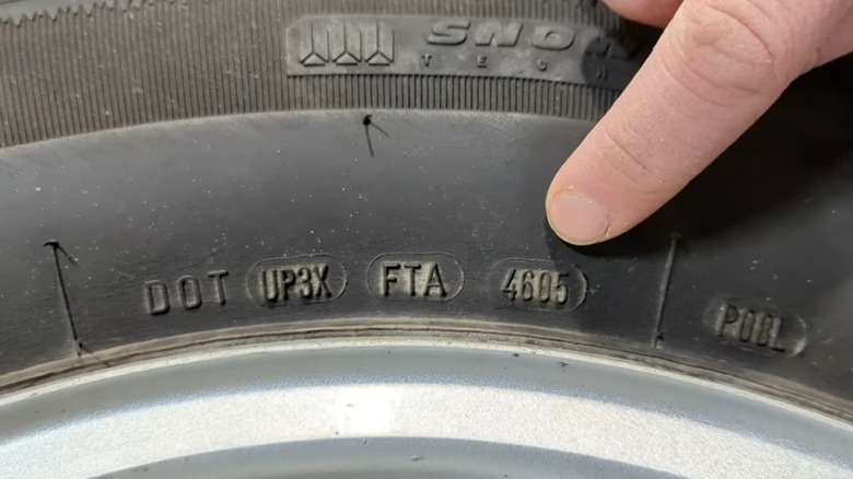 Closeup of DOT date code on sidewall of tire