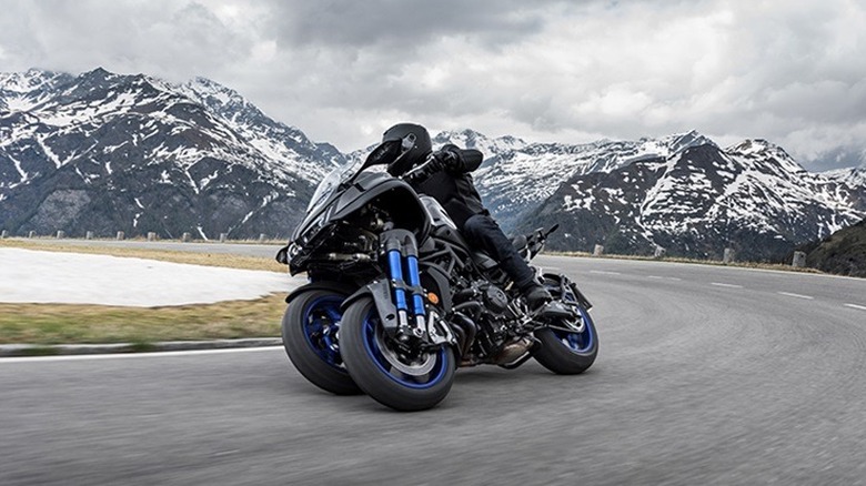 Yamaha Niken motorcycle driving on winding mountain road