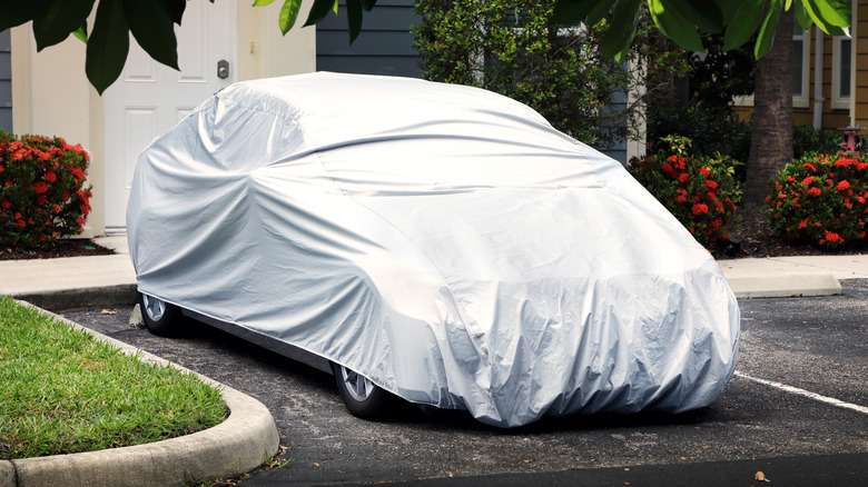 Car covered in a parking lot