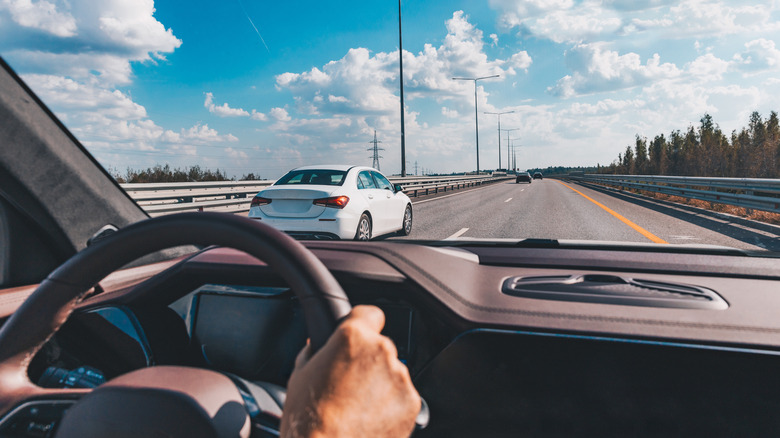 Person driving on a highway