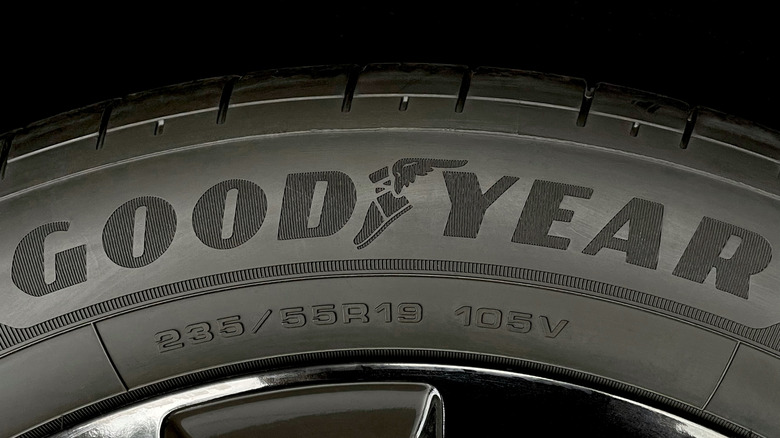 A close-up of a Godyear tire mounted on a rim of