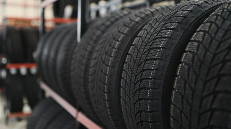 Tires placed next to each other on a tire rack.