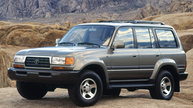 A gray 1998 Toyota Land Cruiser on a hill.