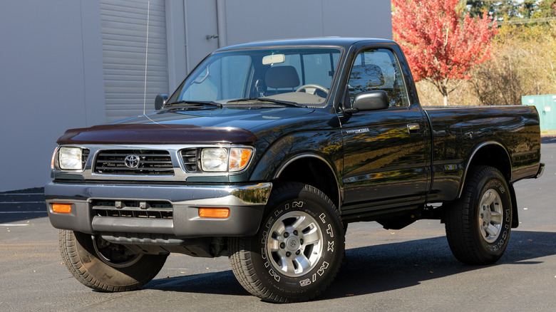 Front shot of a green first-gen Toyota Tacoma
