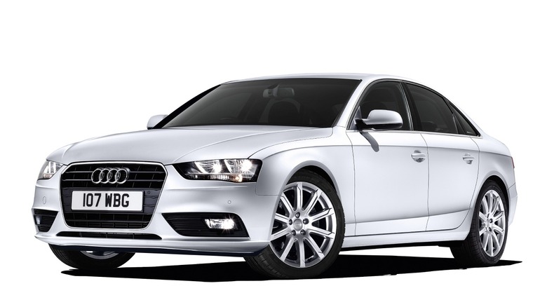 Studio shot of a white 2013 Audi A4 SE Technik TDI