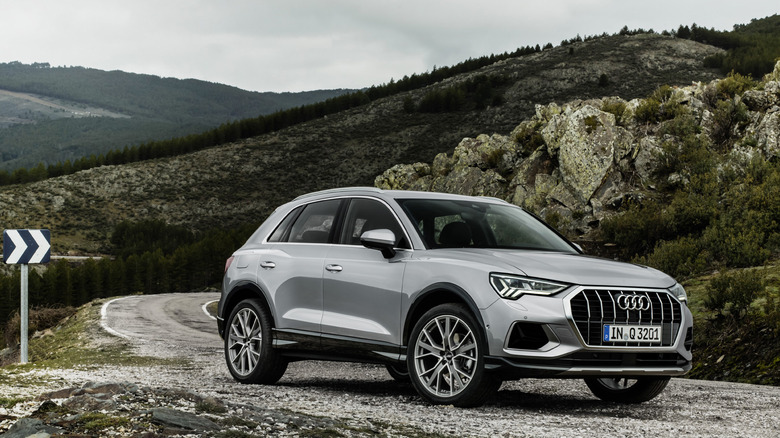 Front-quarter shot of a 2015 Audi Q3 on a road in the mountains