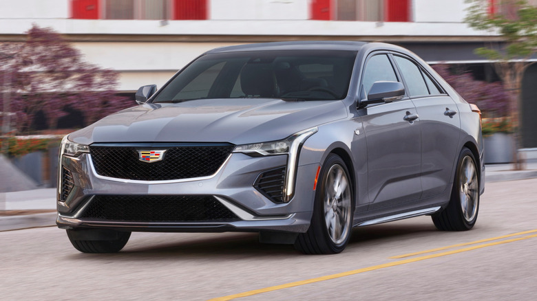 Front 3/4 view of a 2021 Cadillac CT4 driving at speed