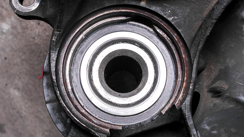 A closeup of a damaged sealed hub bearing