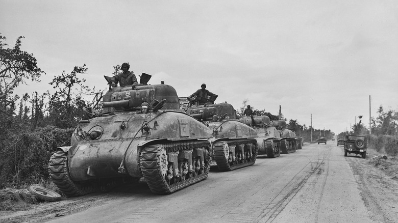 A row of M4 Sherman tanks lined up after the invasion of Normandy in WWII.