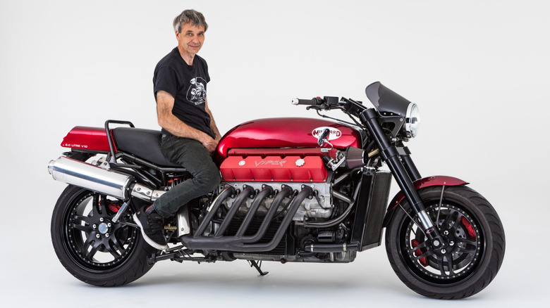Side view of Allen Millyard sitting on his custom-built motorcycle with a Viper V10 engine