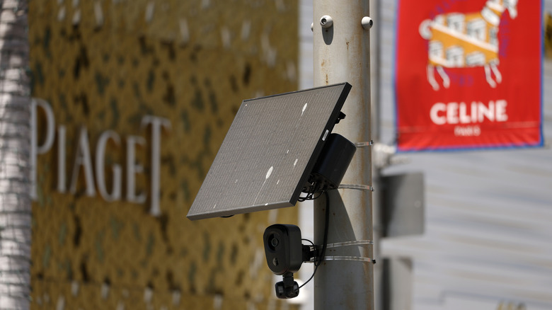 BEVERLY HILLS, CALIFORNIA - AUGUST 03: A Flock Safety camera is shown mounted to a light pole on August 03, 2026 in Beverly Hills, California. Flock Safety's automated license plate reader cameras have been deployed in over 120,000 locations across 49 states, using artificial intelligence to identify vehicles by their license plates, make, model and color to help law enforcement investigate crimes, while also drawing criticism from privacy advocates over concerns about mass surveillance and the collection of motorists' location data.