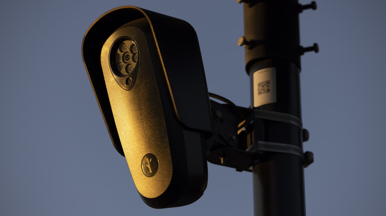 Fullerton, California, USA - July 23, 2026: A Flock camera surveils a city street for car license plates.