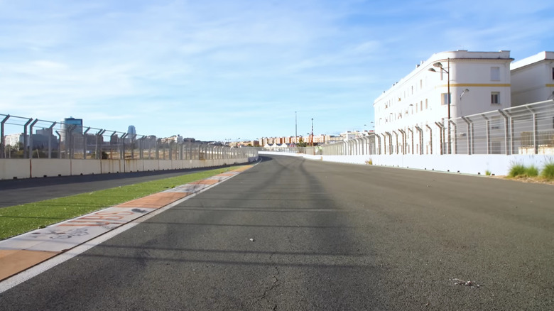 An abandoned stretch of track disappears around a bend.