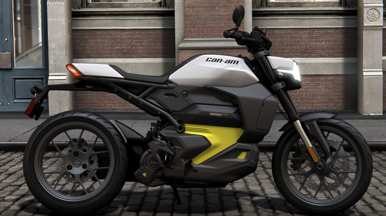 Can-Am Pulse motorcycle faces to the right while stopped on a brick city road.