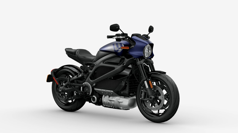 An electric LiveWire ONE motorcycle with blue accents sits in a white studio.