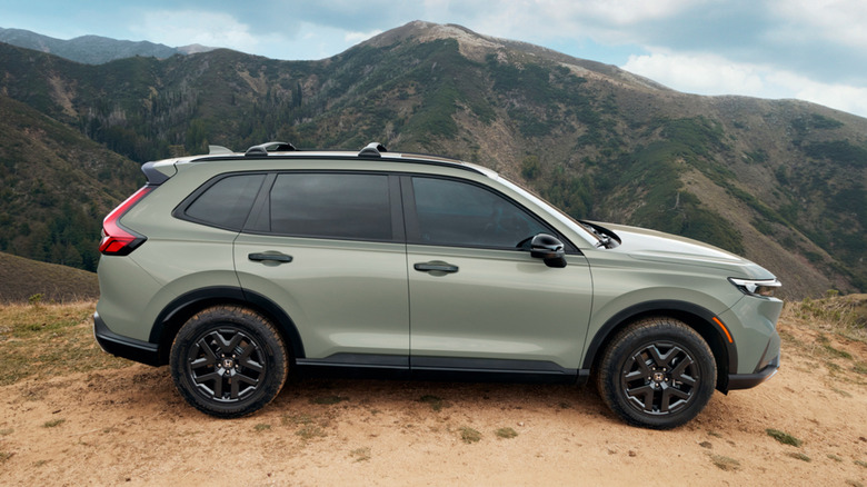 Profile of Honda CR-V TrailSport parked on dirt in front of mountains