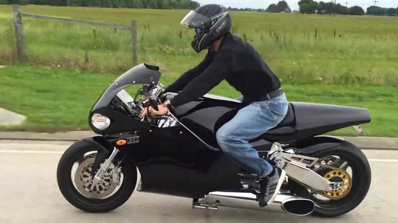 A blue MTT Y2K Turbine Superbike parked on a road.