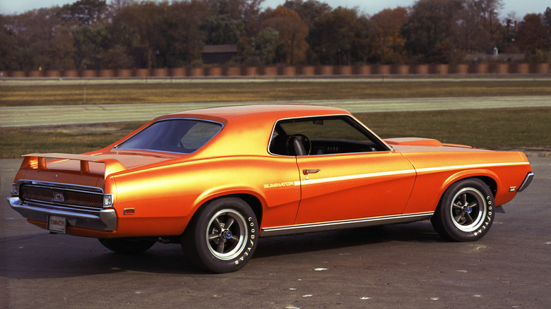 A Competition Orange 1969 Mercury Cougar Eliminator on pavement.