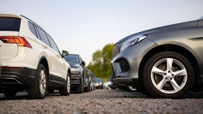 SUVs shown parked in a dealership lot