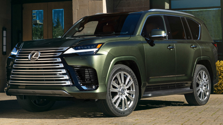 A 2027 Lexus LX 700h Ultra Luxury parked on a driveway.