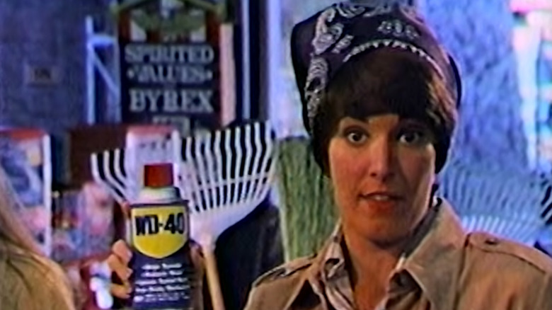 Still showing woman holding can of WD-40 from real TV commercial from 1977