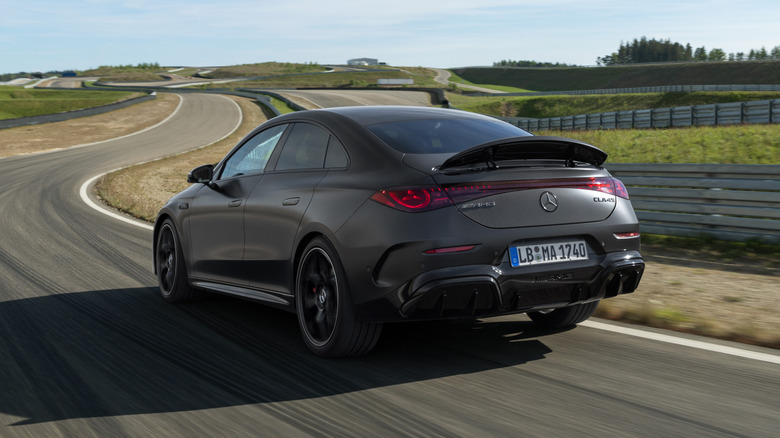 Rear 3/4 view of a matte black Mercedes-AMG CLA45