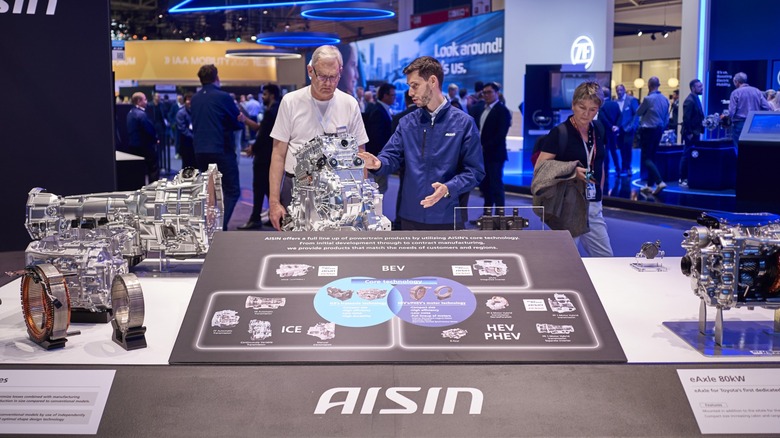 The Aisin booth at a trade show.