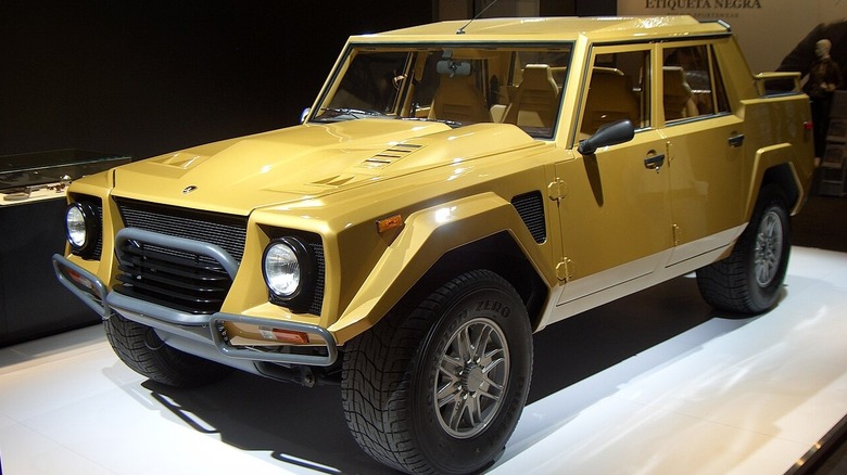 Gold Lamborghini LM002 in an indoor museum setting
