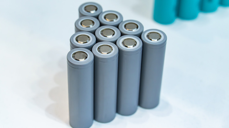 10 lithium-ion batteries on a desk.