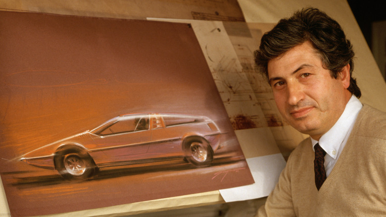 Giorgetto Giugiaro posing with a design