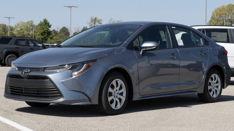 A gray Toyota Corolla sedan in a parking lot.