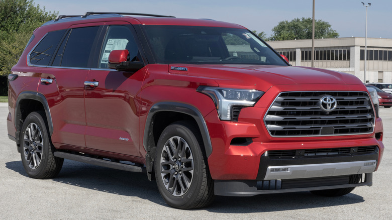 A red Toyota Sequoia in a parking lot.