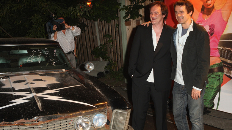 Quentin Tarantino in front of the Death Proof 1970 Chevy Nova