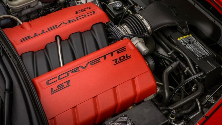 An open hood of a C5 Corvette Z06 showing a modified 7.0-liter LS7 V8