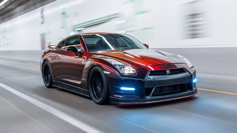 Maroon Nissan GT-R R35 driving in Seattle