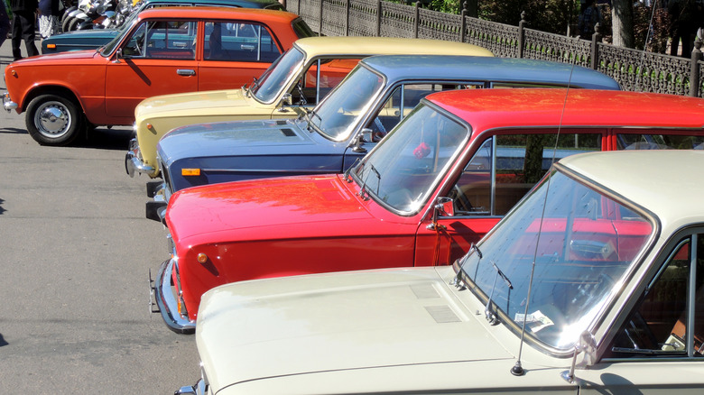 Lada sedans parked outdoors in a row.