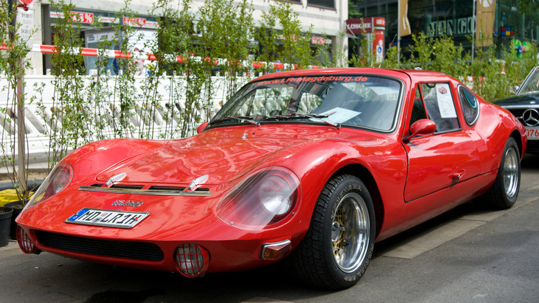 Red Melkus RS 1000 sits parked outdoors.