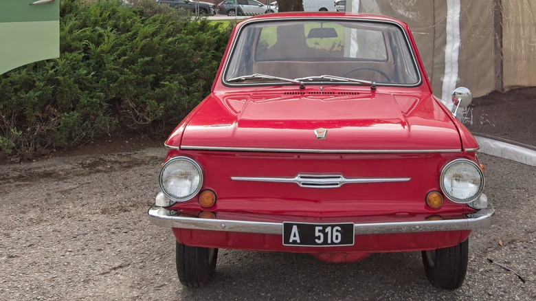 Front view of a red Zaporozhets ZAZ-968 parked outside.