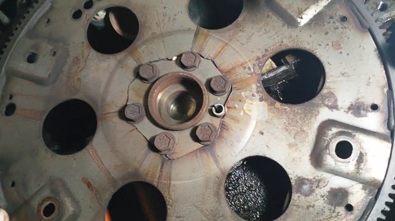 A flexplate that's cracked around the center bolts