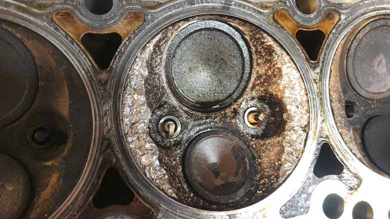 A dropped valve seat in a damaged cylinder head