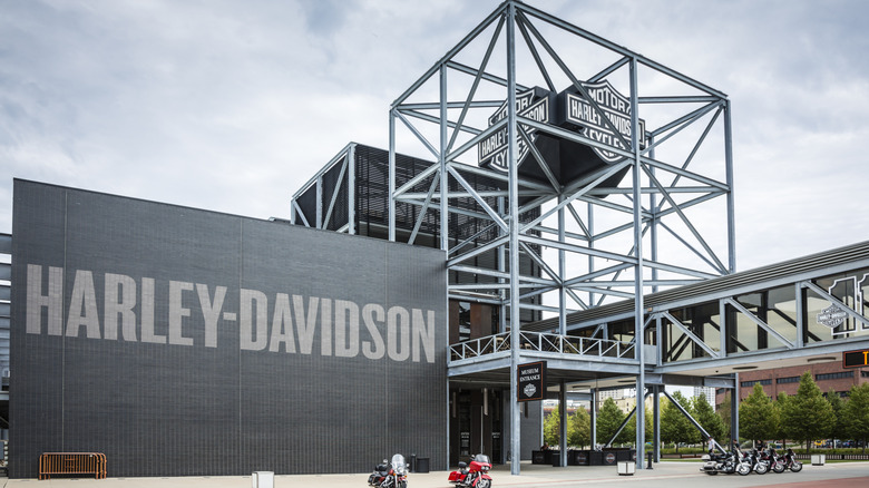 The Harley Davidson museum in Milwaukee under a cloudy sky.