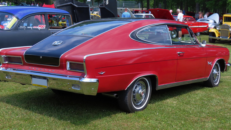 A red and black 967 AMC Rambler Marlin.