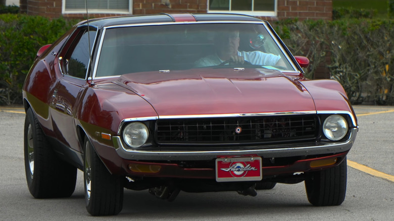 A maroon 1971 AMC Javelin AMX 401.