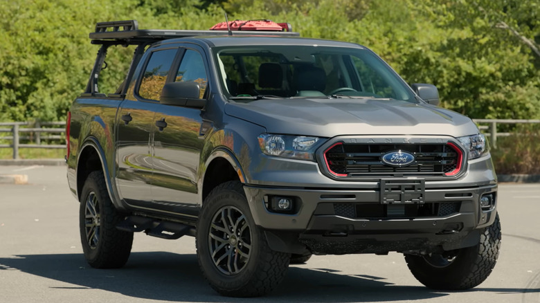 A gray 2022 Ford Ranger Tremor parked in a parking lot in front of trees