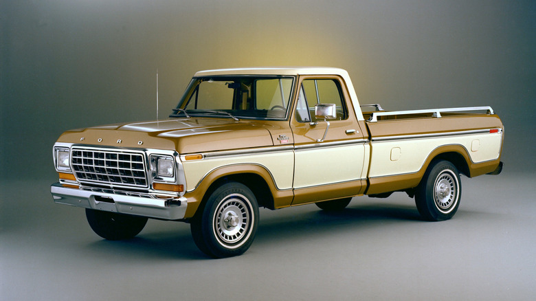 A 1979 Ford F-150 sits parked in studio.